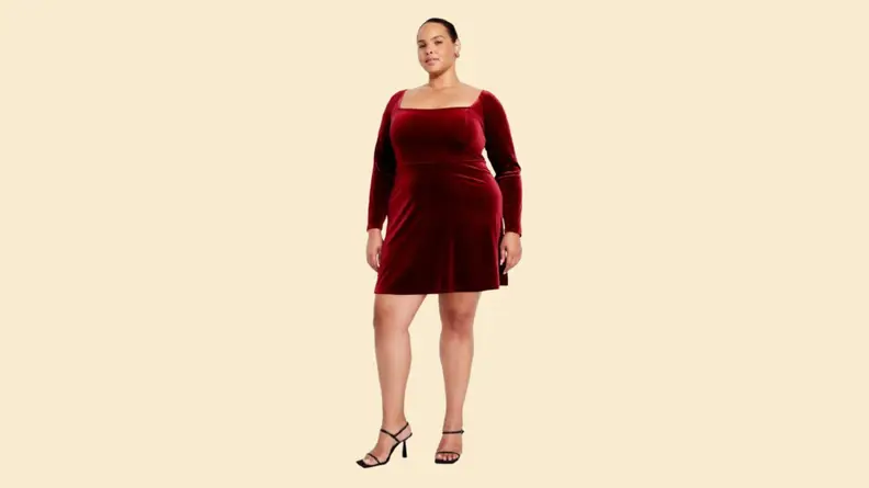 A model wearing a red midi dress.