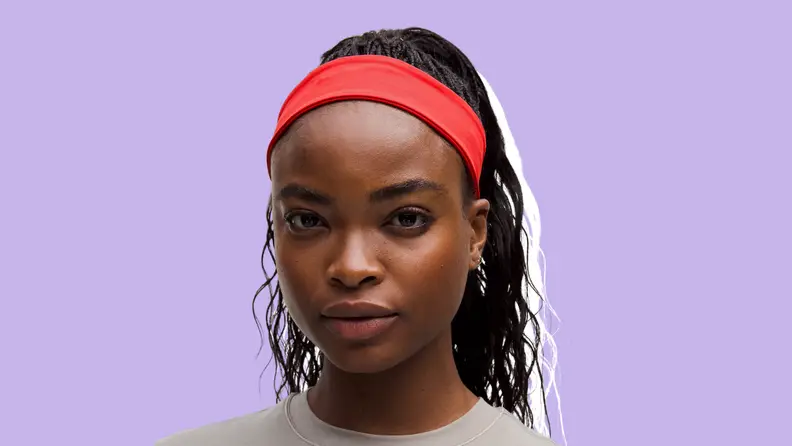 Woman wearing a red lululemon training headband