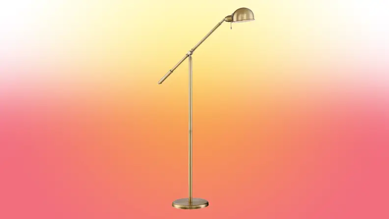 A lamp stands on a red and yellow fade background