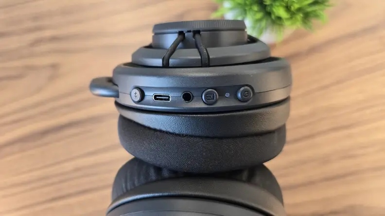 Close-up of the  Turtle Beach Atlas Air wireless gaming headset from the side with controls.