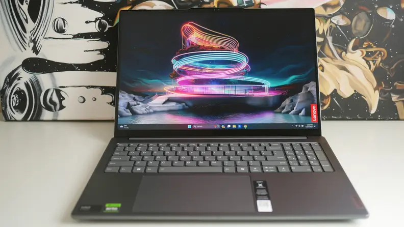 The laptop displaying a screensaver.