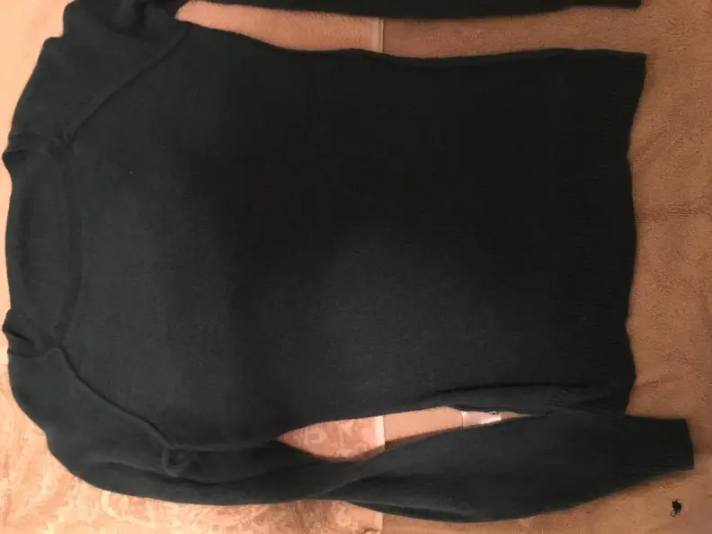 Lay the sweater out flat on a clean towel