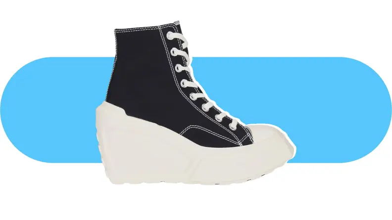 A white and blue knit wedge sneaker.