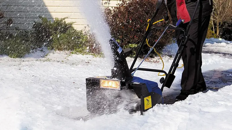 A close-up of the Snow Joe snowblower doing its thing: blowing snow.
