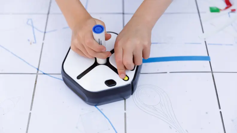 Add the dry erase marker to the center of the Root to start drawing.