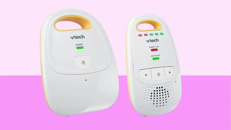 The VTech Safe & Sound DM111 baby audio monitor against a light and dark pink background.