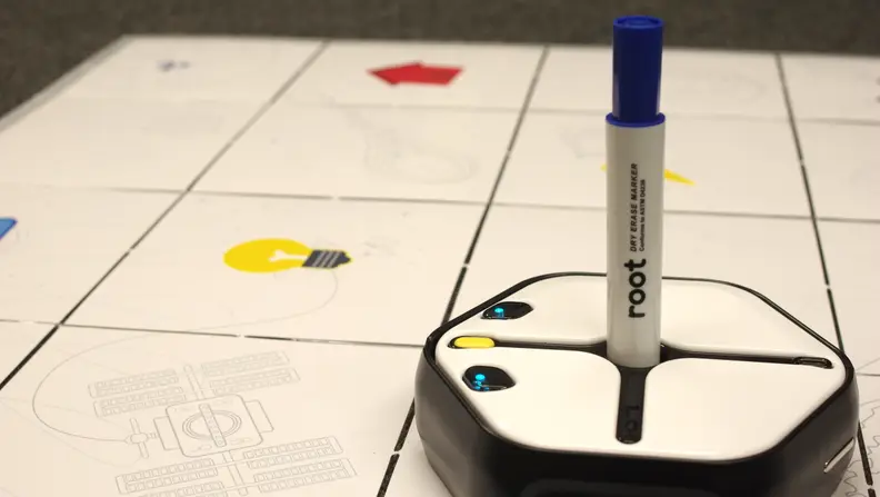 Root Robotics can draw with a marker on a foldable whiteboard grid.