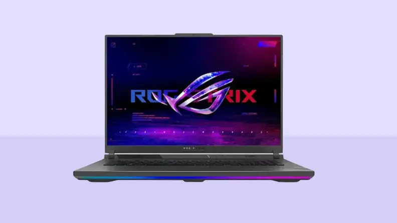 An Asus ROG Strix G18 sits on a dual-tone purple background