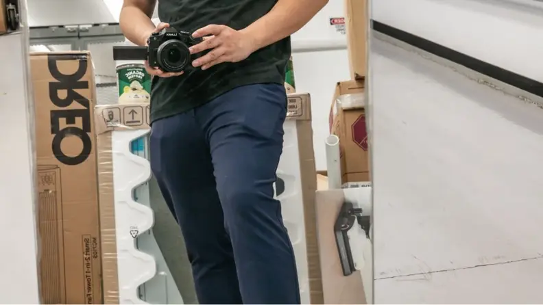 Man wearing Public Rec Game Changer pants with cellphone and wallet in the pockets