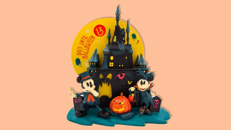 Mickey and Minnie Mouse Halloween Countdown Calendar on an orange background.