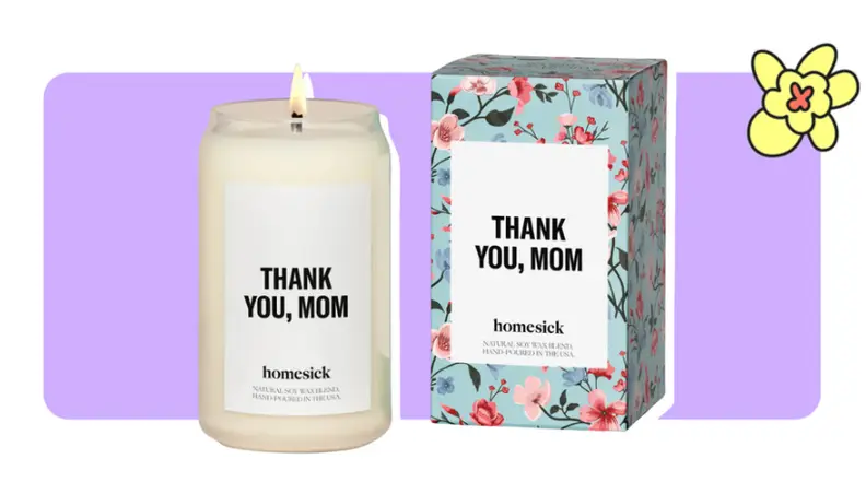 A "Thank You, Mom" candle from homesick next to printed floral box in front of purple background with a yellow cartoon flower in the corner.