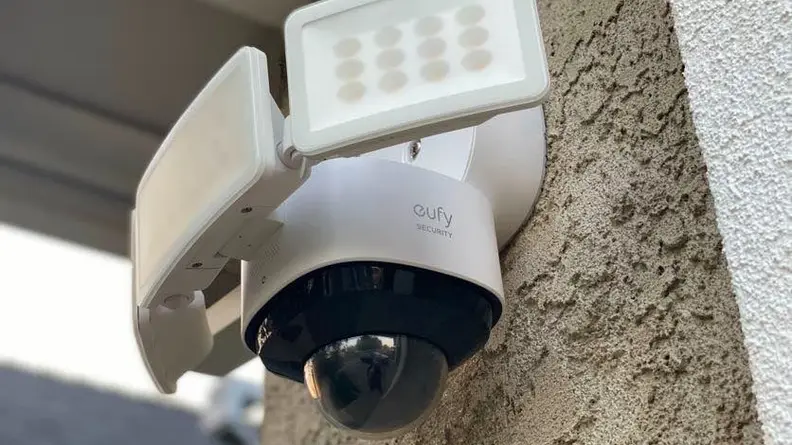 Mounted Eufy Floodlight Cam 2 Pro mounted outside of home.