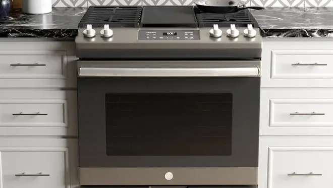 Electric gas range in kitchen.