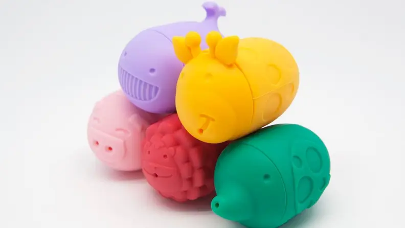 A stack of colorful bath toys made from food-grade silicone.
