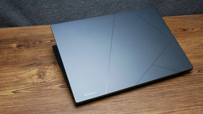 The laptop closed, showing the Asus logo and design.