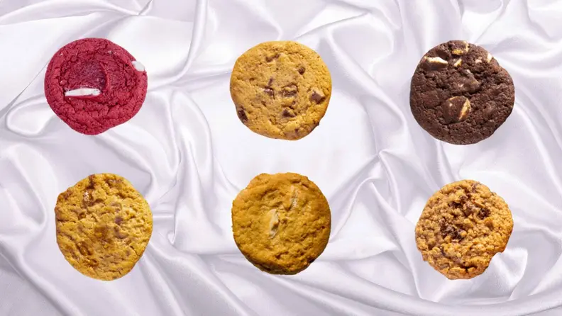 An assortment of cookies arranged in a pattern against a white background.