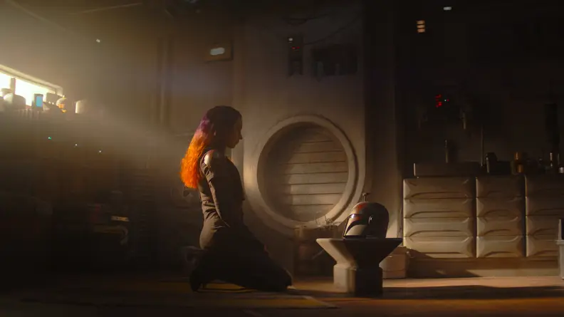 Sabine Wren looking at her helmet