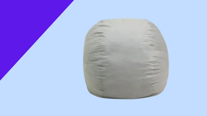 A gray bean bag on a blue background
