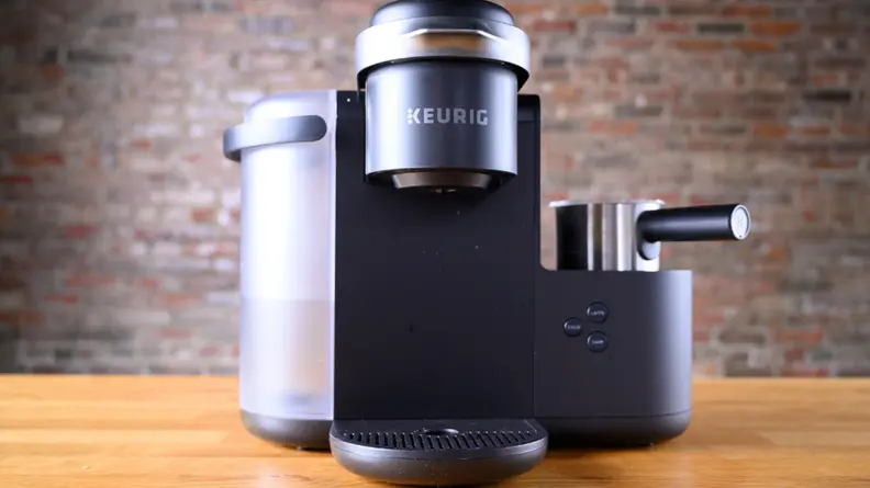 A black Keurig K-Café single serve coffee maker.