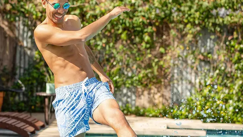 man wearing Chubbies thigh-napple swim trunks