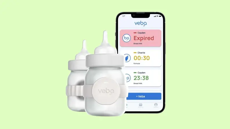 The Veba smart bottle pictured next to a smart phone running the companion app.