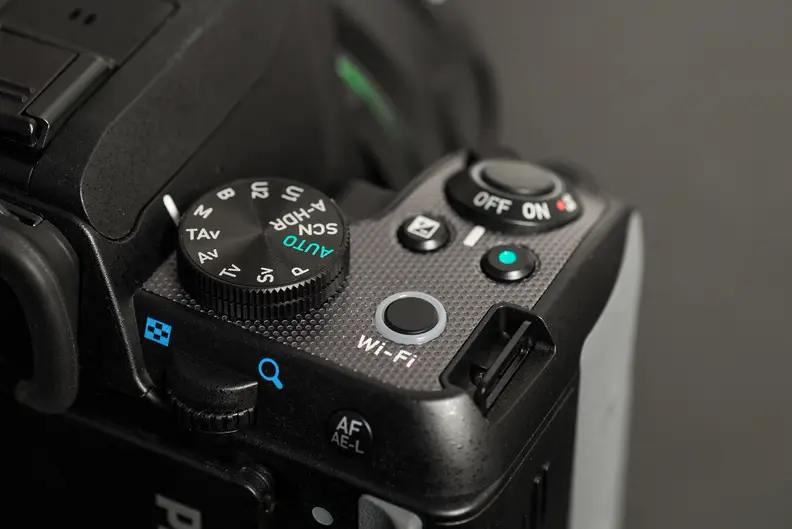 A photo of the Pentax K-S2's top controls.