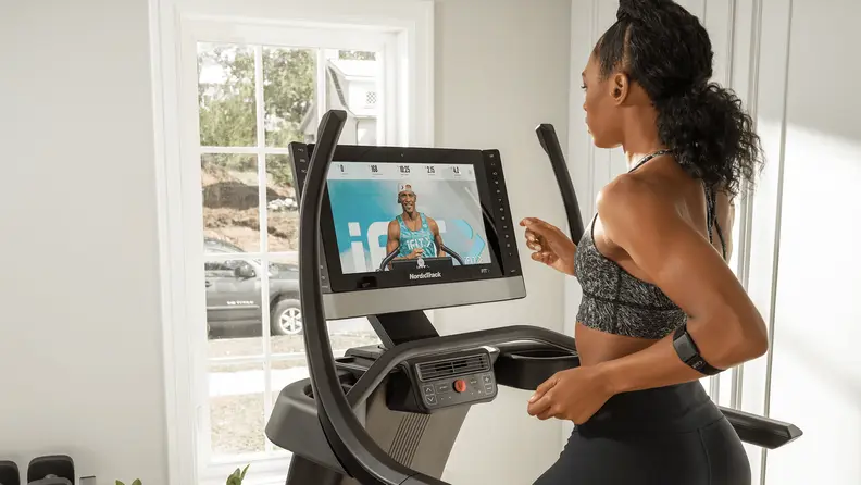 woman running on treadmill