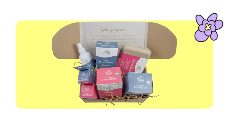 Product shot of a Earth Mama kit with several small boxes inside on top of decorative straw.