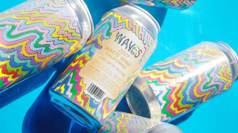 Three cans of Waves wines.