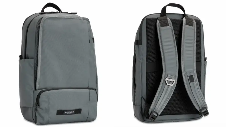 Grey bag standing upright from Timbuk2, backpack straps from Timbuk2 laptop bag.