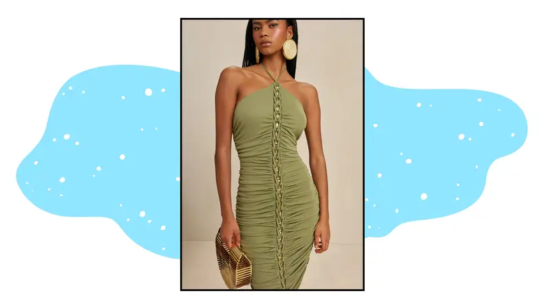 A model wearing a green halter dress with metallic gold details.