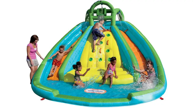 A family playing in a large pool