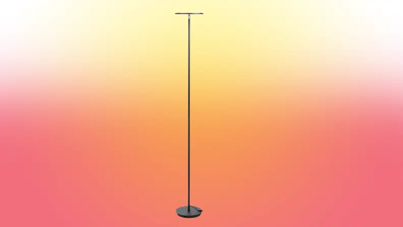 A lamp stands on a red and yellow fade background