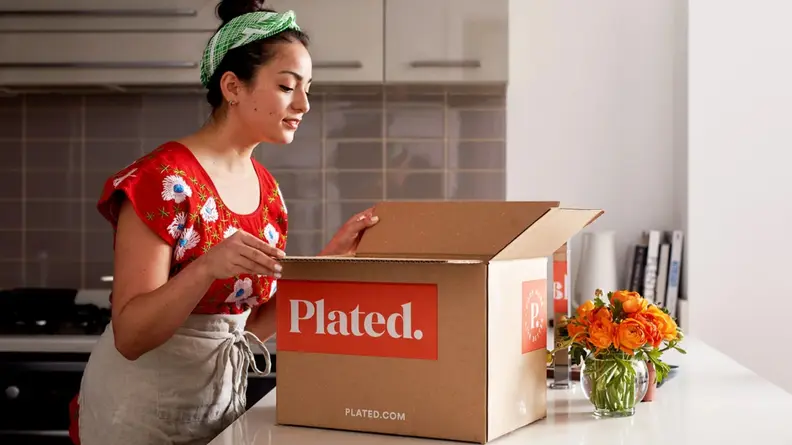 Woman opening Plated box