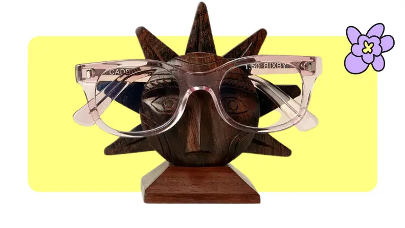 Uncommon Goods Wood Sun Glasses Holder displaying pink glasses