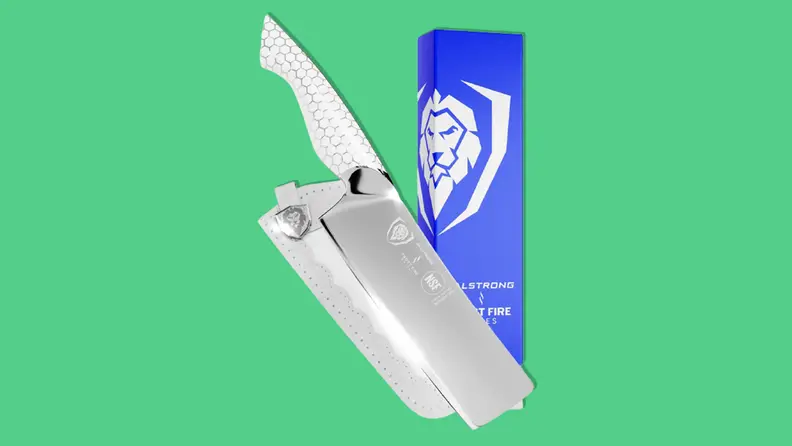 Dalstrong Frost Fire Nakiri knife on green background