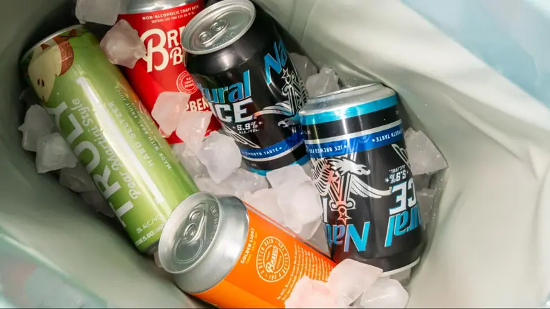 The interior of the Brümate Magpack filled with ice and beer cans.