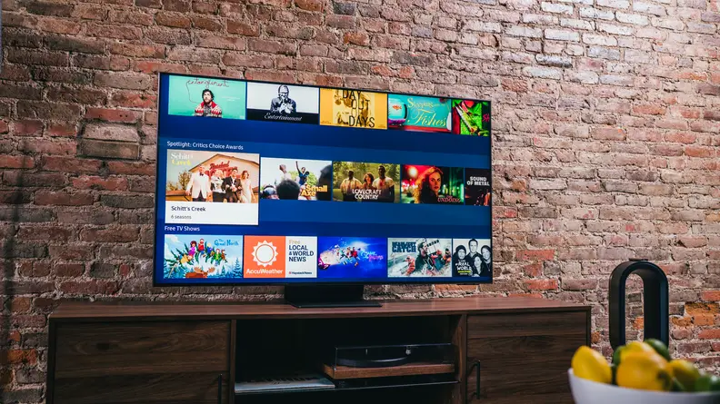 TV sits on a table, displaying smart and streamable content