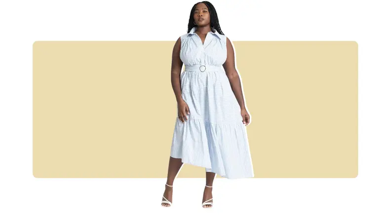 A blue and white striped shirt dress that is belted at the waist and has an asymmetrical ruffled hem.
