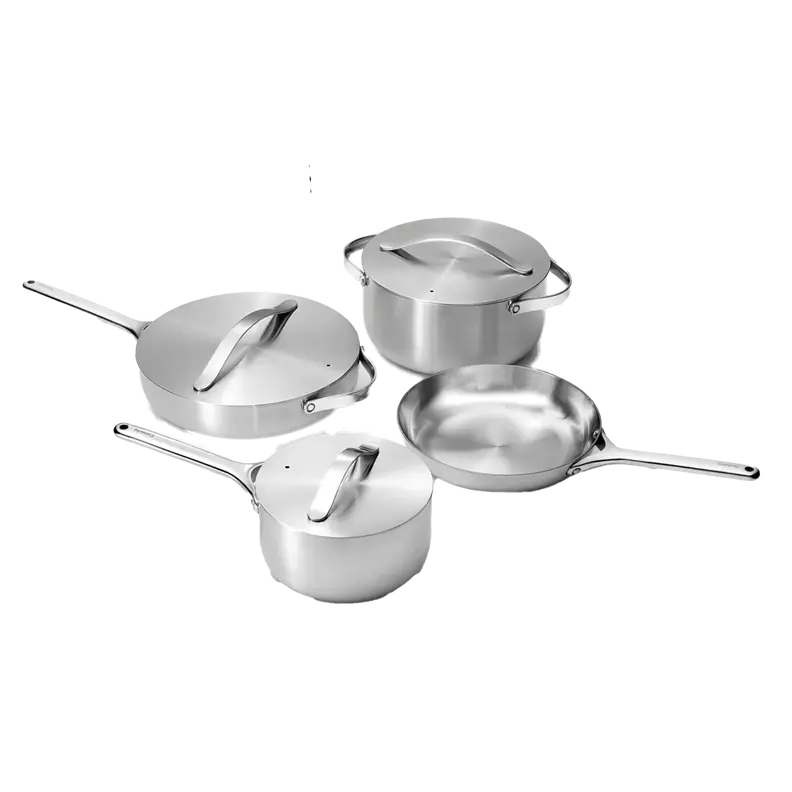 Caraway 4 Piece Stainless Steel Cookware with lids on top.