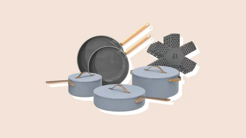 Product shot of light blue assorted pots and pans from the from the Beautiful by Drew Barrymore Kitchen Appliances line.