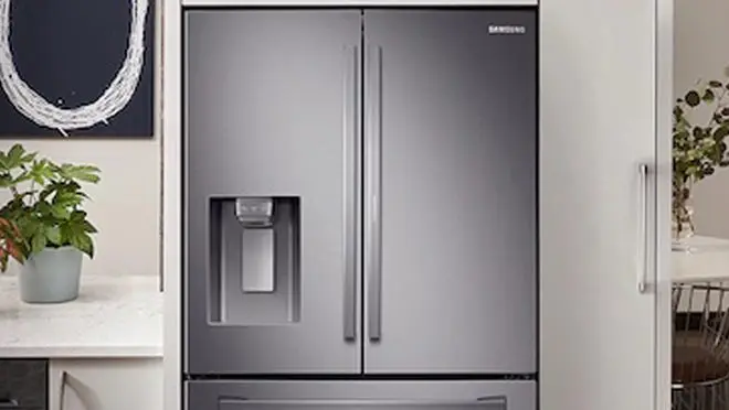 Stainless steel double door refrigerator in kitchen
