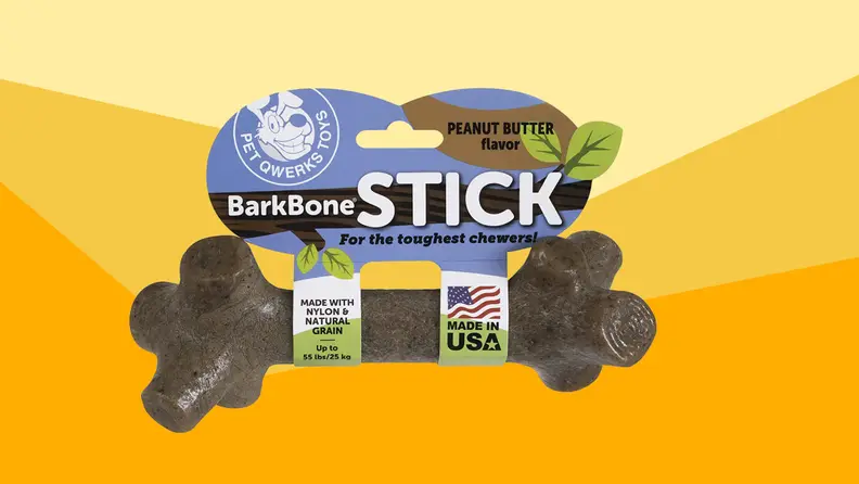 A brown-black Barkbone in packaging against a varied yellow background.