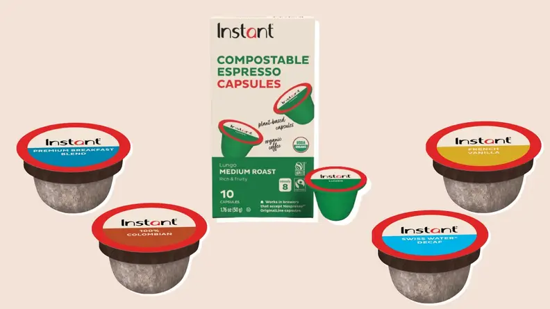 Assorted coffee pods surrounding box of Instant Dual Pod espresso pods.