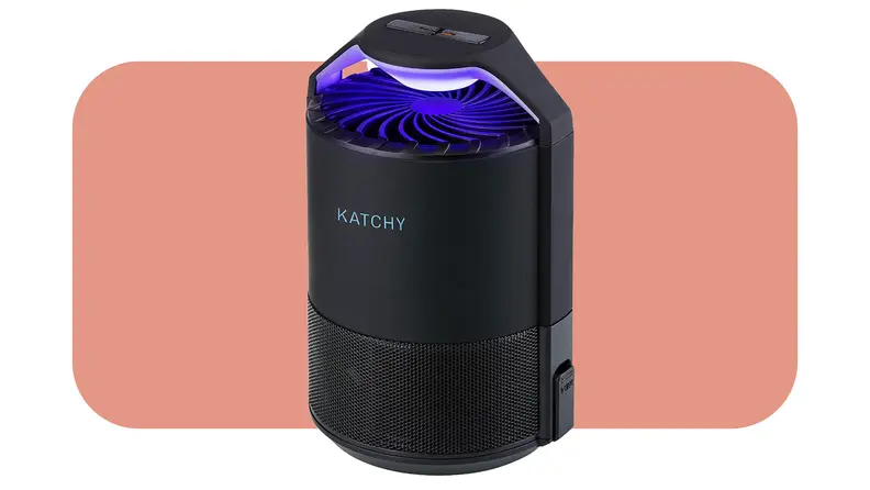 Product shot of the Katchy Indoor Insect Trap with blue UV shining on top in front of pink background.