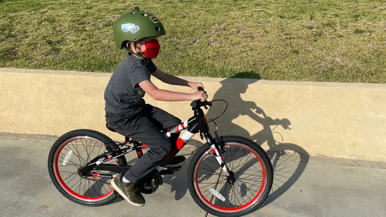 A boy riding a Guardian Kids Bike