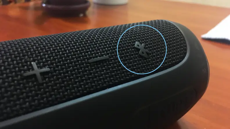 A JBL Flip 4's Bluetooth discoverability button