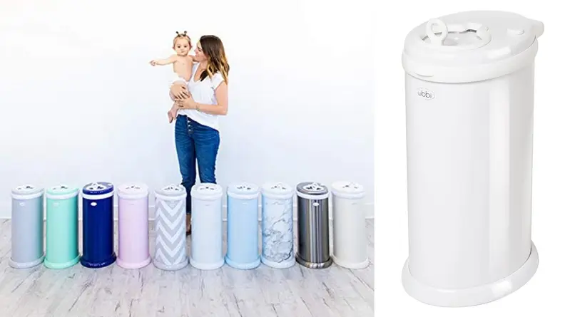 A woman holding a baby stands in front of a row of colorful Ubbi Steel Diaper Pails.
