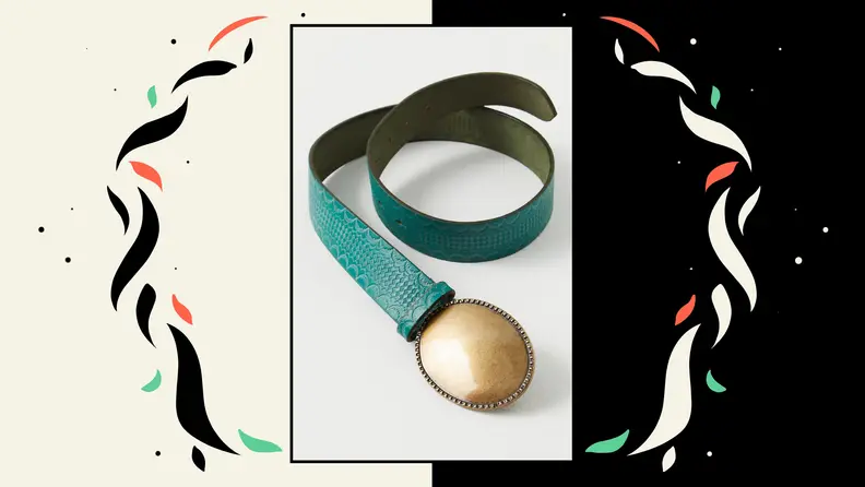 An embossed leather belt with a brass oval belt buckle.