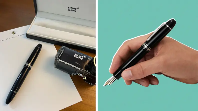A hand holding a black fountain pen and the pen and ink and case on a desktop.